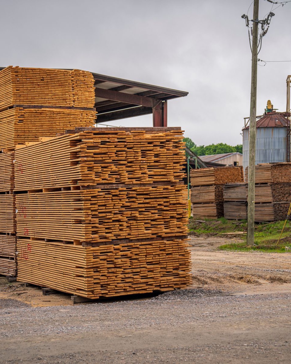 Stacked and stickered lumber packs in a North American timber yard
