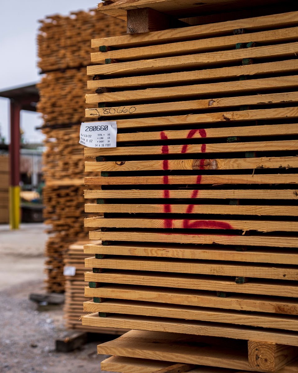 Stickered North American lumber packs staged in a working yard